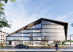 Rendering of a glass-sided building with a dramatic angular roofline.